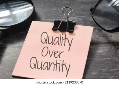 Quality Over Quantity wording with magnifying glass. Management concept - Shutterstock ID 2119238870