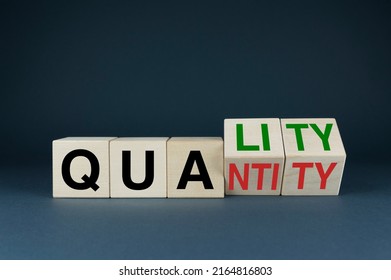 Quality or Quantity. The cubes form the choice words Quality or Quantity. Business concept of quality versus quantity - Shutterstock ID 2164816803