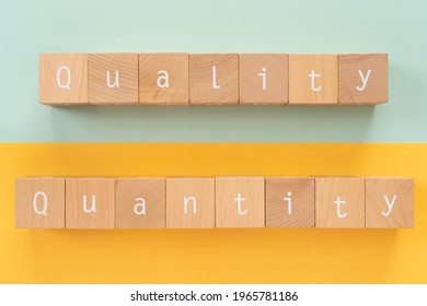 Quality and quantity; Wooden blocks with "Quality Quantity" text of concept. - Shutterstock ID 1965781186