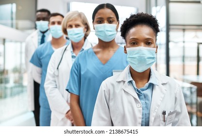 Quality And Safety Is Number One In Healthcare. Portrait Of A Group Of Medical Practitioners Wearing Face Masks While Standing Together In A Hospital.