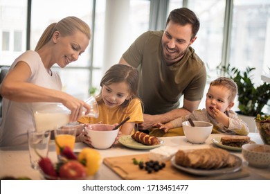 Quality Time With Great Food. Family In  Kitchen Eating Together. 