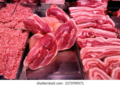 Quality Various Fresh Raw Pork Meat In Fridge Showcase At Modern Butcher Shop. Meat Counter. Close-up.