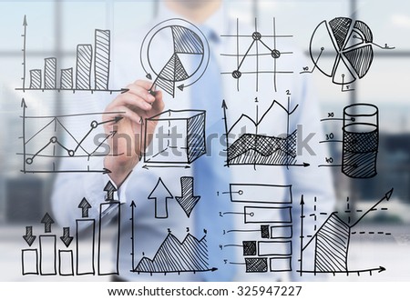 Quantitative analyst is drawing different charts on the glass screen. A concept of professional financial consulting services.