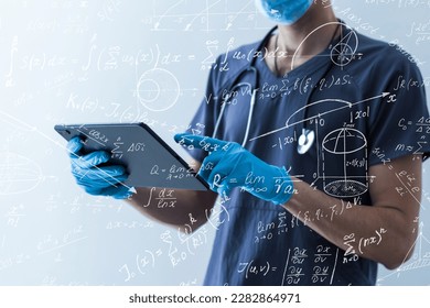 Quantitative analyst is drawing different math formulas on the glass screen.