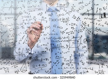 Quantitative analyst is drawing different math formulas on the glass screen. A concept of professional financial consulting services. - Powered by Shutterstock - Get 15% off with code: PIKWIZARD15