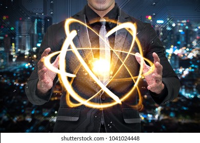 Quantum Computer Technology Concept. Man In Suit Holding Science Yellow Shining Cosmic Atom Nuclear.