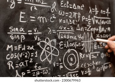 Quantum physics operations written by hand with a chalk on the blackboard - Powered by Shutterstock - Get 15% off with code: PIKWIZARD15