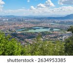 Quanzhou city aerial view including historic Licheng district and Xihu (West Lake) Park, from top of Mount Qingyuan, Quanzhou, Fujian Province, China.   