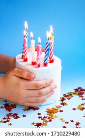 Quarantine Birthday. Burning Candles In Roll Of White Toilet Paper As Birthday Cake In Hands. Social Distance, Isolation Durante Coronovirus Pandemic