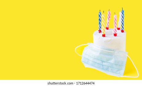 Quarantine Birthday. Burning Candles In Roll Of White Toilet Paper As Birthday Cake And Medicine Mask. Social Distance, Isolation Durante Coronovirus Pandemic