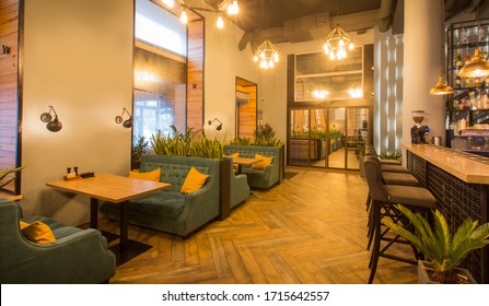 Quarantine time. Modern cafe interior. Light walls and green furniture in stylish restaurant design, copy space, panorama - Powered by Shutterstock