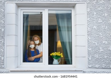 Quarantine window home for mother and daughter - Shutterstock ID 1681954441