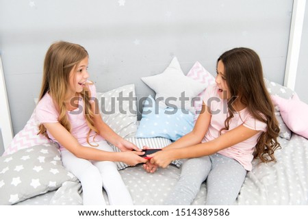 Similar – child girl playing checkers with her dad at home