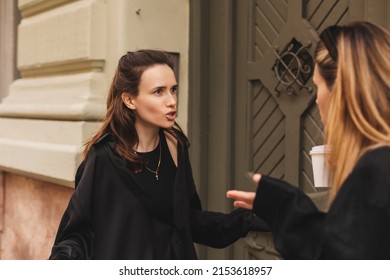 Quarrel two friends. Two women screaming at each other. Two young women argue near door outdoor on the street. Family problem. Angry female show emotion. Depression people. Stress family photo. - Powered by Shutterstock