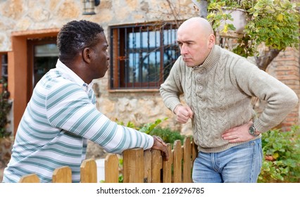 Quarrel of two neighbors in the country in the village. High quality photo - Shutterstock ID 2169296785