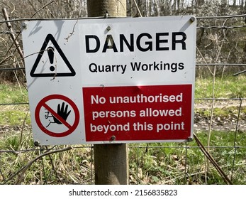 A Quarry Danger, No Unauthorized Persons Beyond This Point Sign Fence Post