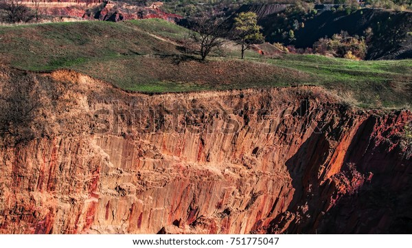 Quarry\
excavations in the earth\'s crust. Kryvbas Kryvyi Rih Ukraine. The\
collapse of the earth\'s crust after\
mining