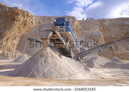 The quarry, stone crushing and production of building materials. Open pit mining and processing plant for crushed stone.