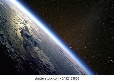 Quarter crescent moon and the thin line of Earth’s atmosphere over the island of Hispaniola. Collage. Elements of this image furnished by NASA. - Powered by Shutterstock