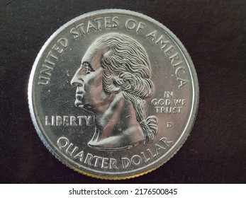 Quarter Of A Dollar On A Black Background, Silver Against Black, 