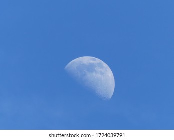 Quarter of the moon in a blue sky