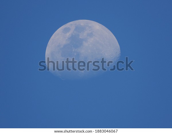 Quarter moon and blue sky.\
Location\
Dieng, Wonosobo, Central Java, Indonesia         \
