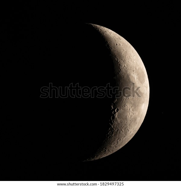 Quarter moon through a\
telescope