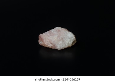 Quartz Stone, Close-up Of Raw Pink Quartz Stone Isolated On Black Background. Precious Raw Mineral Rock