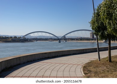 Quay curve on the Danube river. The road-railway bridge has its curves. Like the Danube itself, which flows next to the city of Novi Sad.