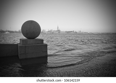 Quay of the river Neva in the historical center of St.-Petersburg during flooding. Monochrome.