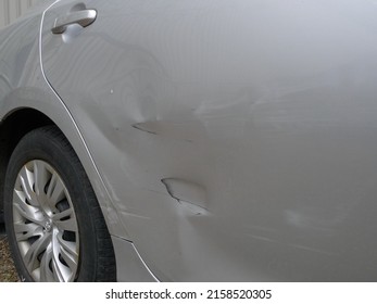 Quebec, Canada - 05-20-2022: A Damaged Car Door