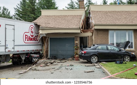 Quebec, Canada - June 2015 - Van Hit House And Cut In Half.