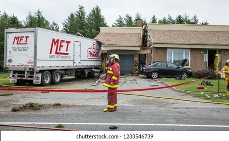 Quebec, Canada - June 2015 - Van Hit House And Cut In Half.