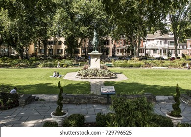 Quebec City 13.09.2017: Bronze Statue Of Sancta Joanna D Arc - Joan Of Arc Stands As A War Memorial In A Colorful Garden On A Sunny Day