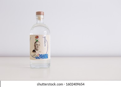 Quebec City, Quebec, Canada, December 31, 2019 - Bottle Of Parsnip Flavoured Gin De Marie-Victorin Set On Plain Cream Background