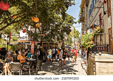 QUEBEC CITY, CANADA - July 2022: Quebec City Old Town Narrow Street With People On Sunny Summer Day, Canada