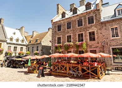 QUEBEC CITY, CANADA - July 2022: Quebec City Old Town  Street Cafe With People On Sunny Summer Day, Canada