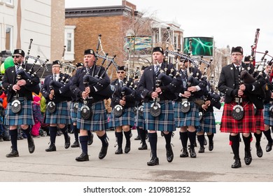 Quebec City, Quebec, Canada, March 23, 2019- Selective focus low angle view of the Chicago Police Pipe Band in blue or red kilts parading during the annual St. Patrick parade