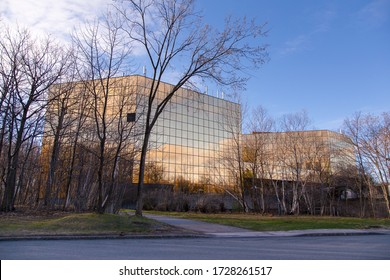 Quebec City, Quebec, Canada, May 11, 2020 - Rear View Of The Quebec Government Income Tax Head Office Marly Building Seen In The Morning Golden Light 