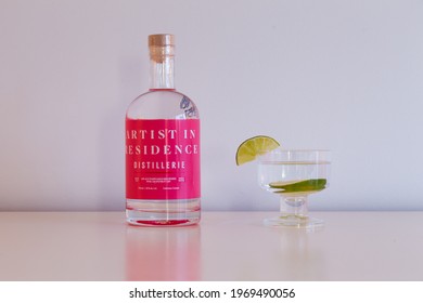 Quebec City, Quebec, Canada, May 7, 2021 - Bottle Of Small Batch Gatineau Produced Artist In Residence Pink Grapefruit Gin With Glass Set On Plain Cream Background