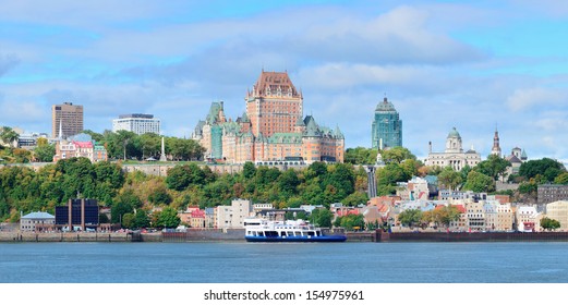 Quebec City skyline panorama over river with blue sky and cloud.