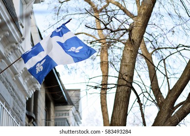 Quebec Flag In Montreal Billowing In The Breeze Outside