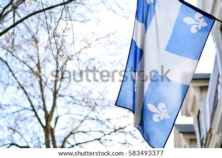 Quebec flag in Montreal billowing in the breeze outside