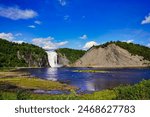 Quebec,Canada,September 2,2023-Magnificent view of the Montmorency Falls on a bright summer day with blue skies near Quebec city, the capital of Quebec province,Canada