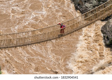 Quechua Woman Crossing Queshuachaca (Q'eswachaka) Rope Bridge, One Of The Last Standing Incan Handwoven Bridges, Quehue, Canas Province, Peru