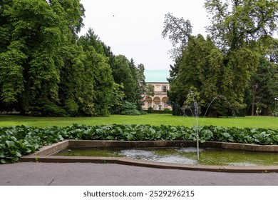 Queen Anna's Summer Palace (Belvedere) in Prague's Royal Garden with Fountain and Lush Greenery in the Foreground