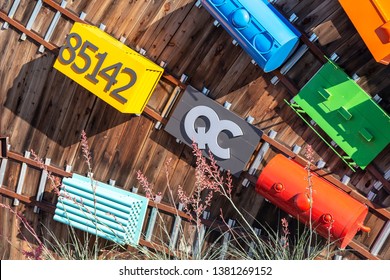 QUEEN CREEK, ARIZONA / UNITED STATES - APRIL 25, 2019: Billboard sized sign at the corner of Rittenhouse Rd. and Ellsworth Rd displaying model railroad cars with the QC acronymn and local zip code.