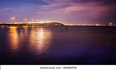 The Queen Isabella Causeway (bridge) leads to South Padre Island, Texas at sunset