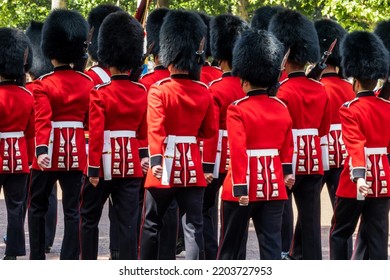 Queen royal british guards in red uniforms during guards changing parade on the Mall in London UK