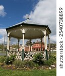 The Queen Victoria Bandstand in Creswick, Victoria, Australia was built in 1897 to honour Queen Victoria in her diamond jubilee year (with historic buildings in background.)  